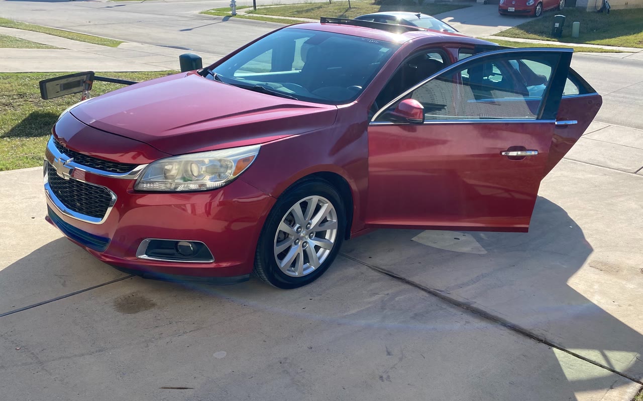 Our Chevy Malibu with the doors open