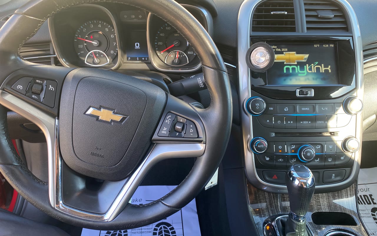 The Chevy Malibu's steering wheel, gauges and touchscreen